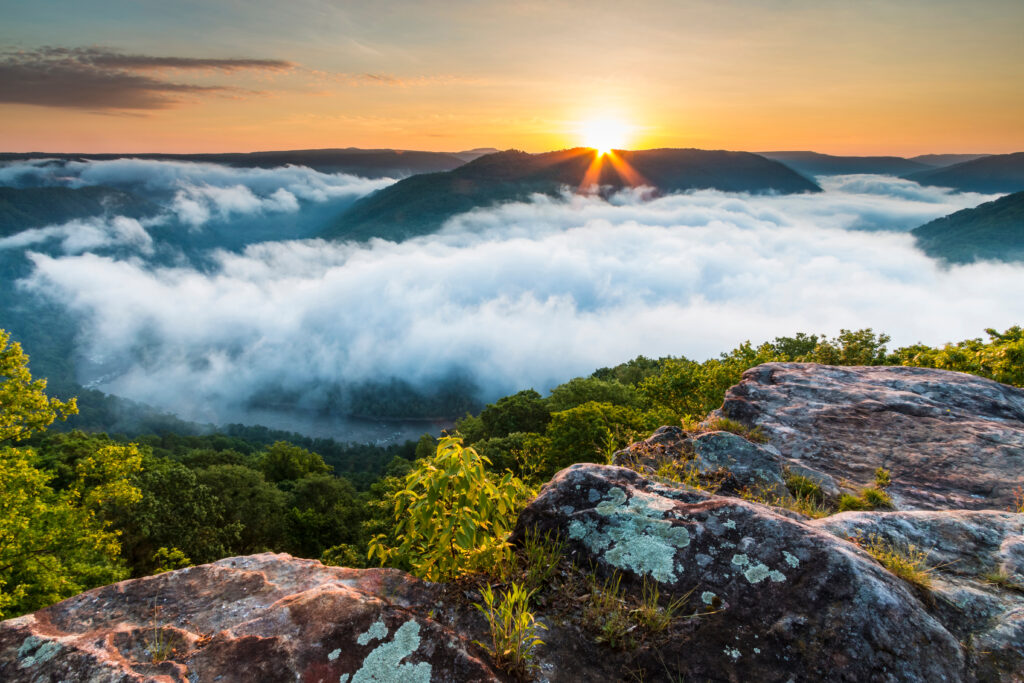 Dramatic spring landscapes in New River Gorge National Park in West Virginia,USA. Clouds covering the gorge during sunrise in the Grandview overlook .it is the newest national park in the US.